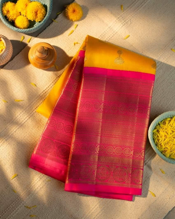Traditional Kanchipuram Yellow Color With lovely Pink Pallu WEAVING at its finest and most classic!