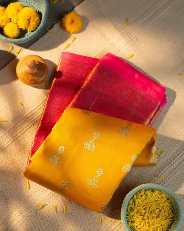 Traditional Kanchipuram Yellow Color With lovely Pink Pallu WEAVING at its finest and most classic!